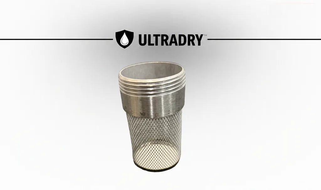 A premium 100 gram stainless steel ULTRADRY branded mesh desiccant port shown against a white background with a subtle gray gradient and a horizontal ULTRADRY logo banner above.
