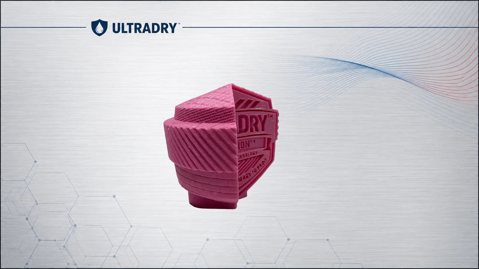 Deep pink textured UltraDry emblem block 3D printed in Basic Deep Pink PETG
