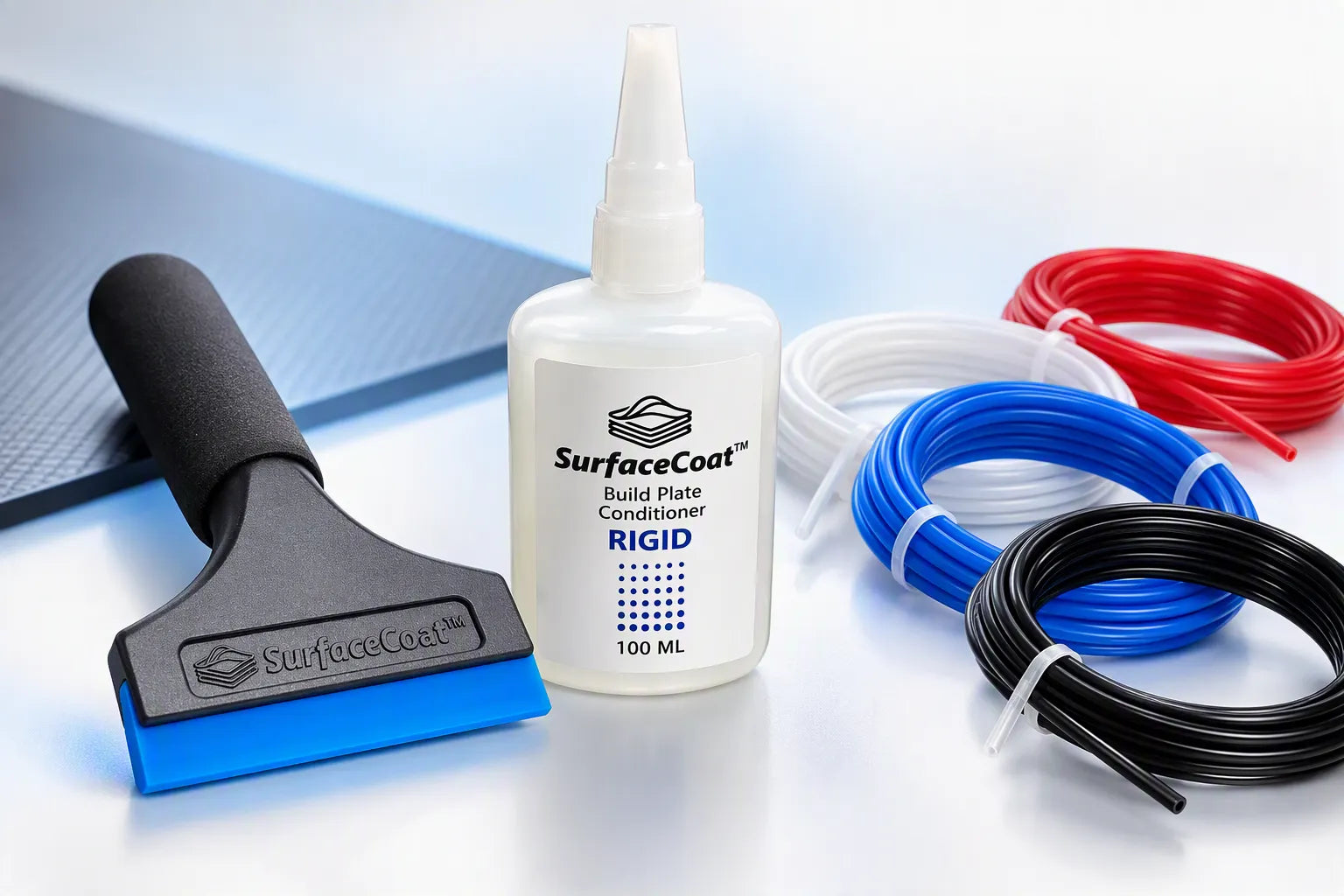 SurfaceCoat squeegee, Rigid build plate conditioner bottle and red, white, blue and black PTFE tubing